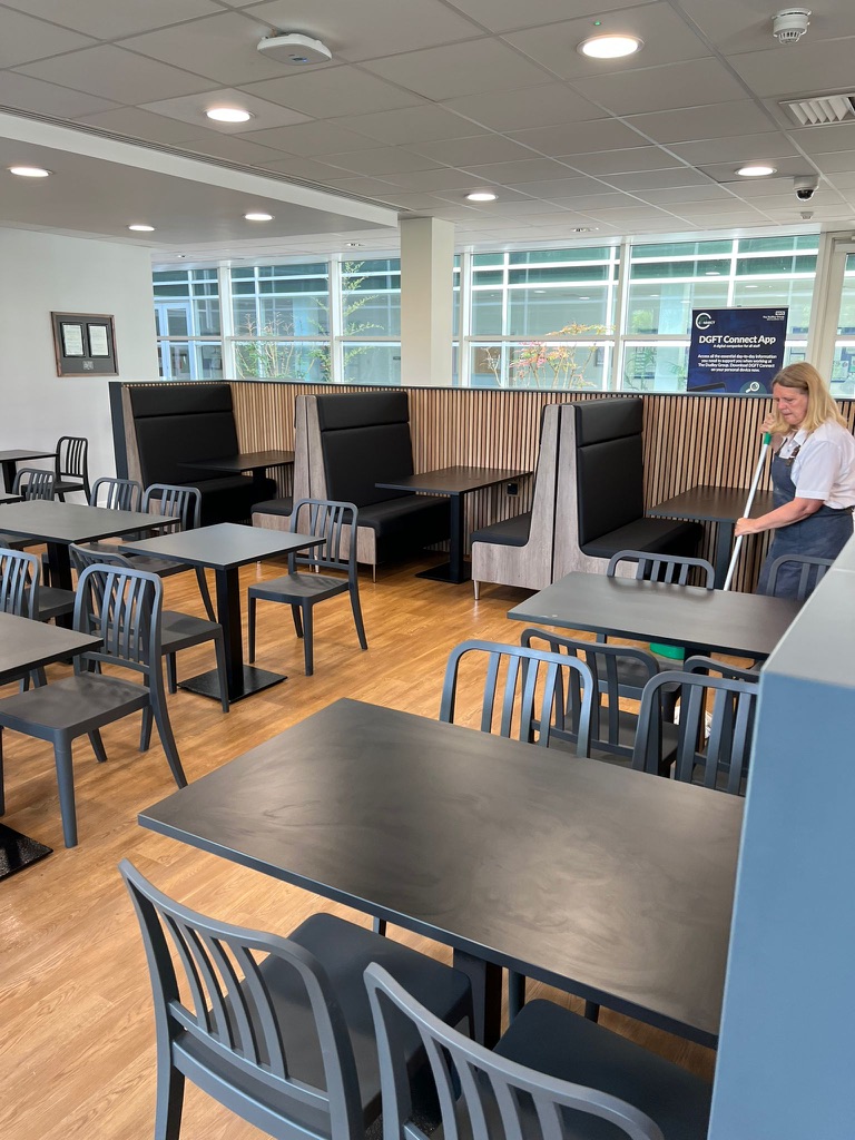 Canteen dining area with booth seating and timber panelling