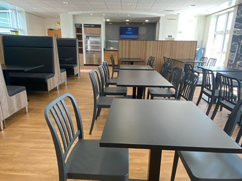 Full canteen overview with booth seating and servery