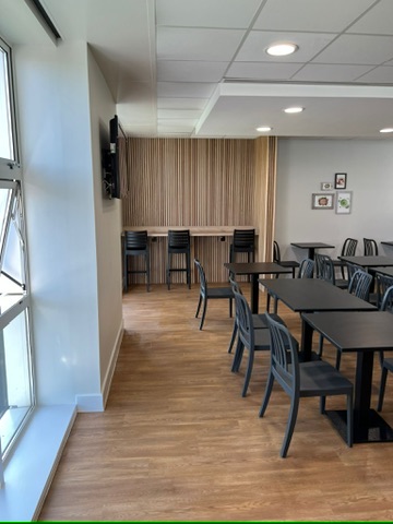 Dining area with timber slat divider and window seating