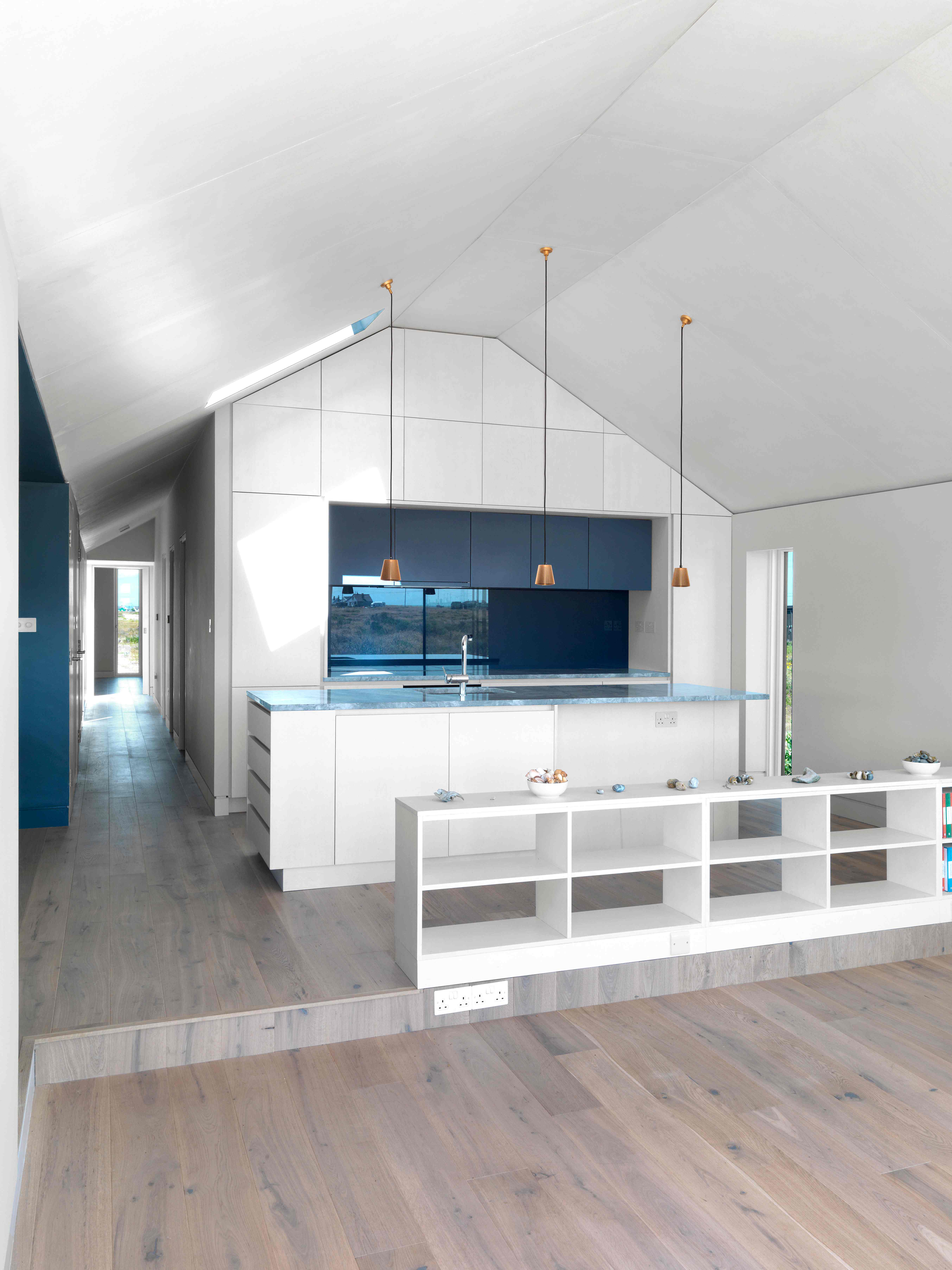 Kitchen with vaulted ceiling and pendant lights