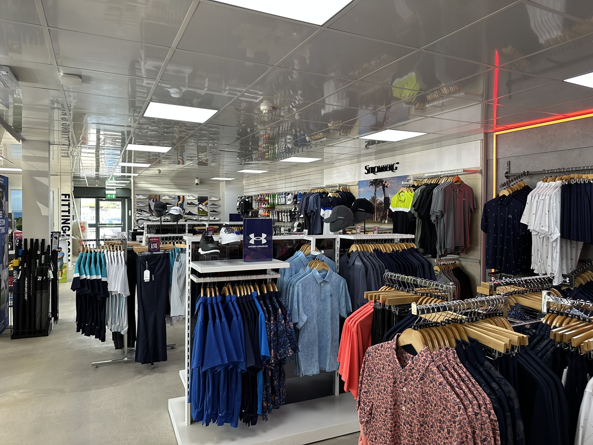 Store overview with clothing rails and brand zones